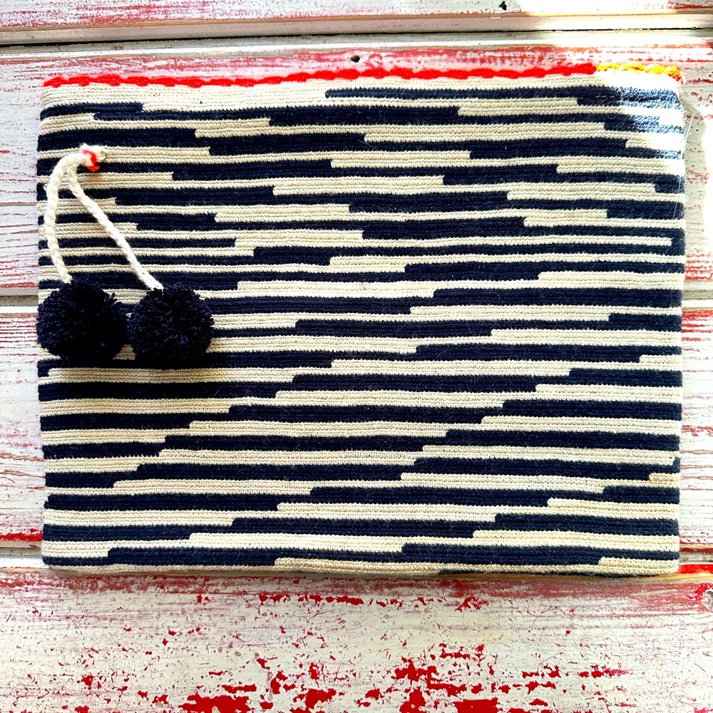 {Sophie Anderson} Woven Textured Clutch with Pom Poms